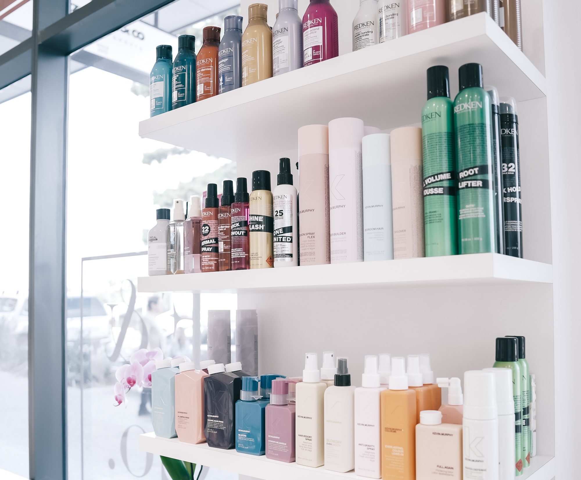 Shelves of Redken, Kevin Murphy and Pureology haircare stocked at Elizabeth & Co.